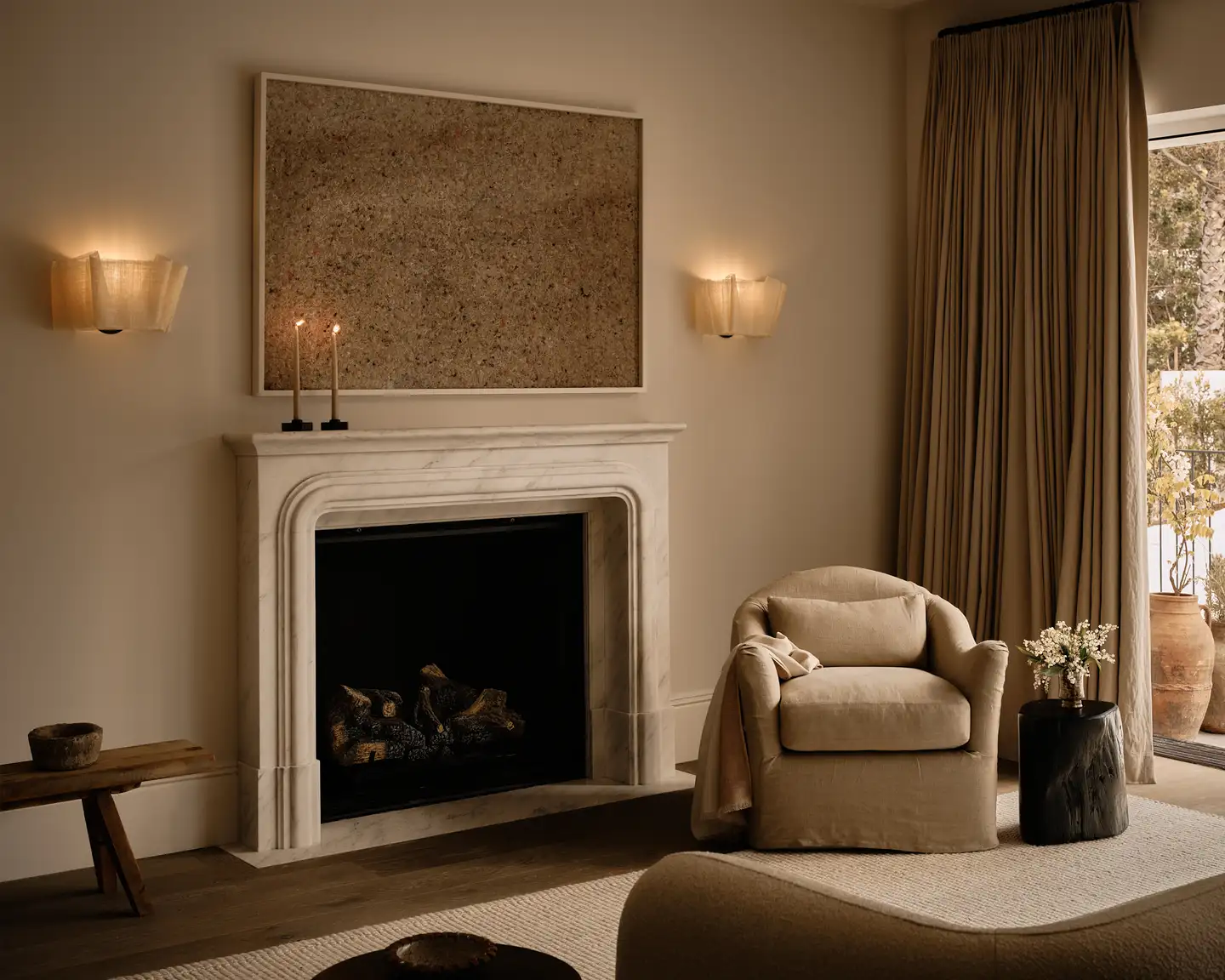 Cozy Corner In A Living Room With Cream Walls And With A Fireplace And With A Cream Armchair And With Brown Curtains