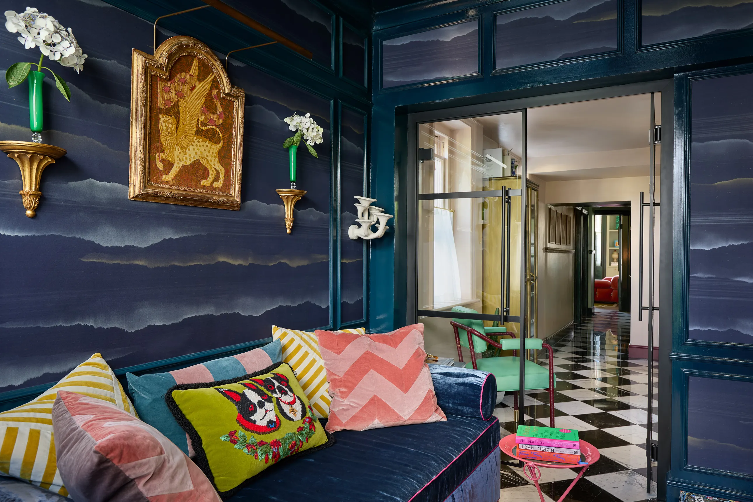 Harris Reed Living Room With Royal Blue Walls And With A Chequered Tile Floor And With A Velvet Blue Sofa And With Textured And Colorful Pillows